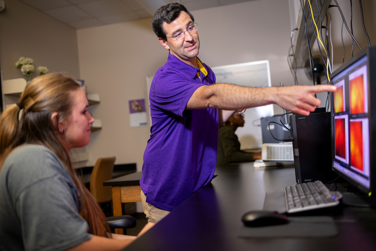 Student Abby Rehagen works with Paul Miller in the COMET Lab