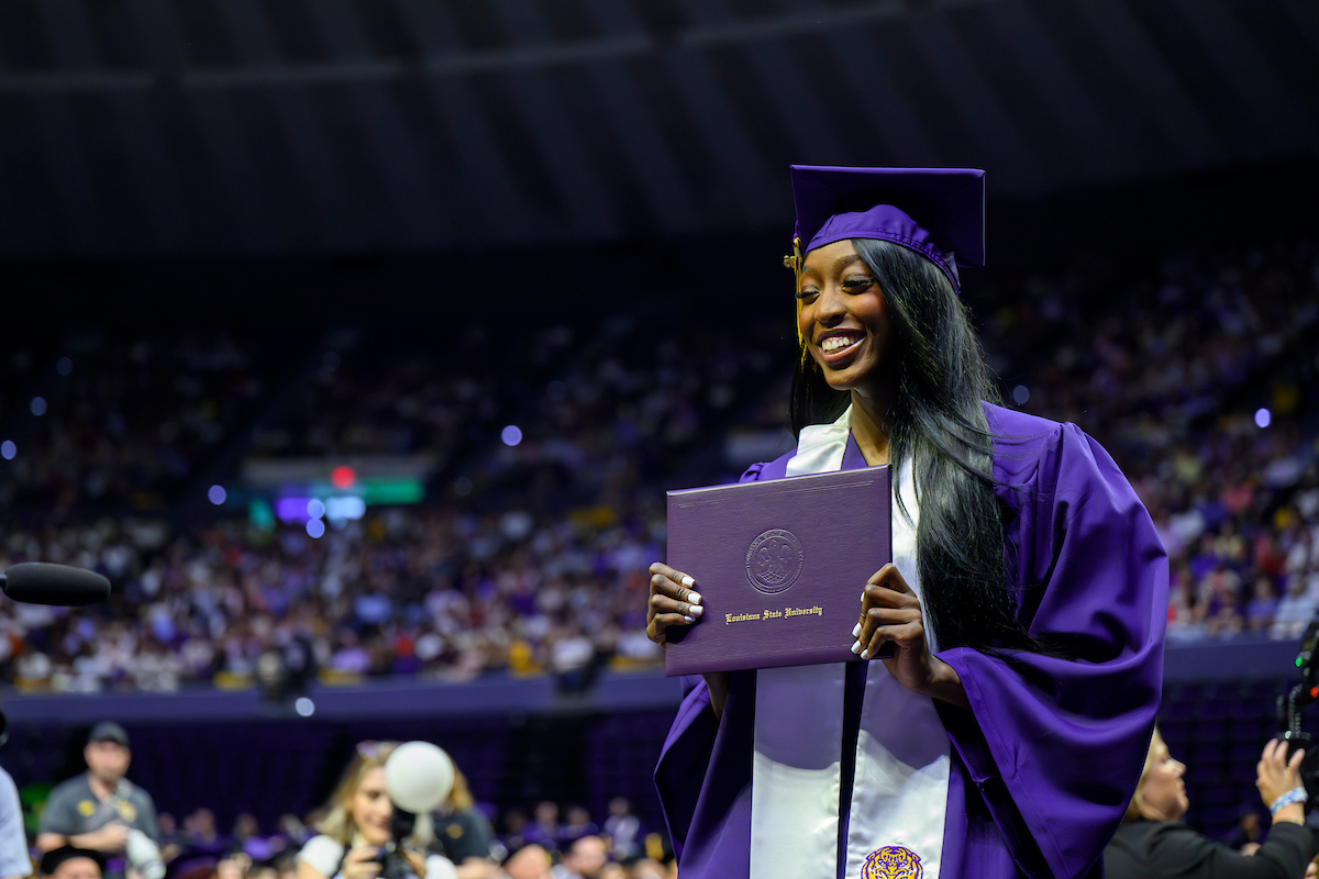 Flau'jae Johnson shows off her diploma case at commencement