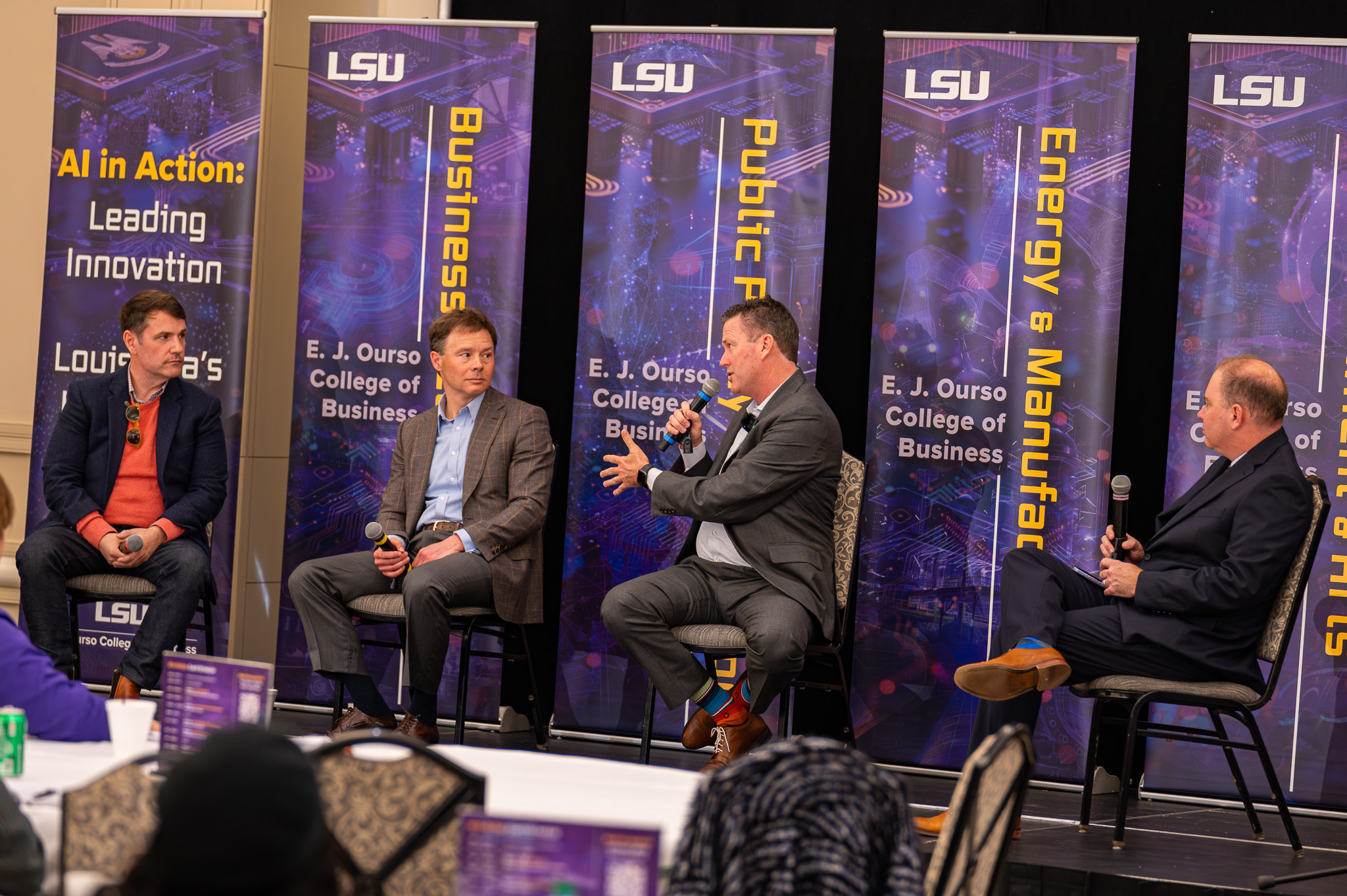 Members of the AI in Business panel hold a discussion at the AI in Action Symposium on February 21, 2025.