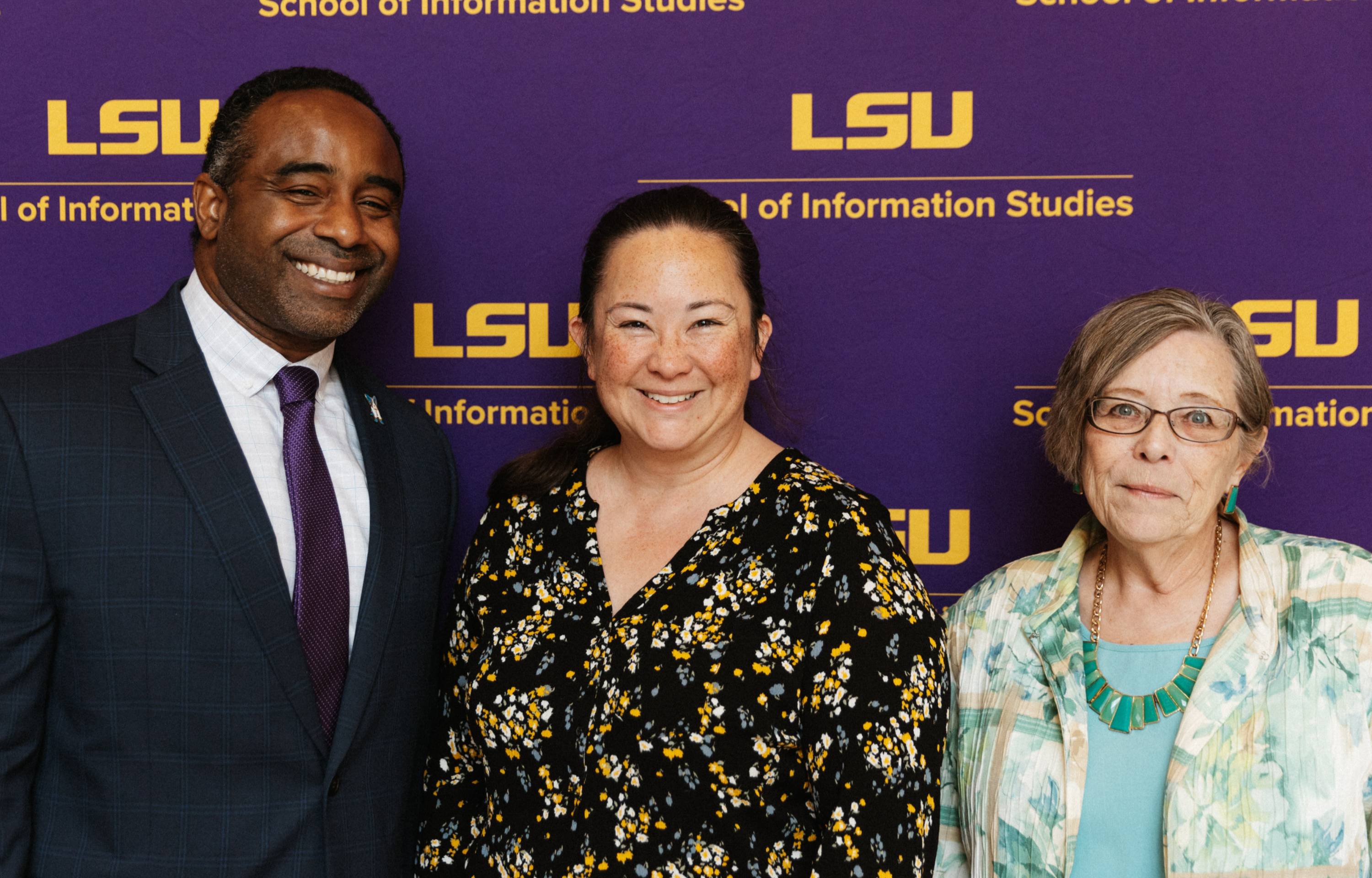 Dr. Carol Barry poses in a group photo