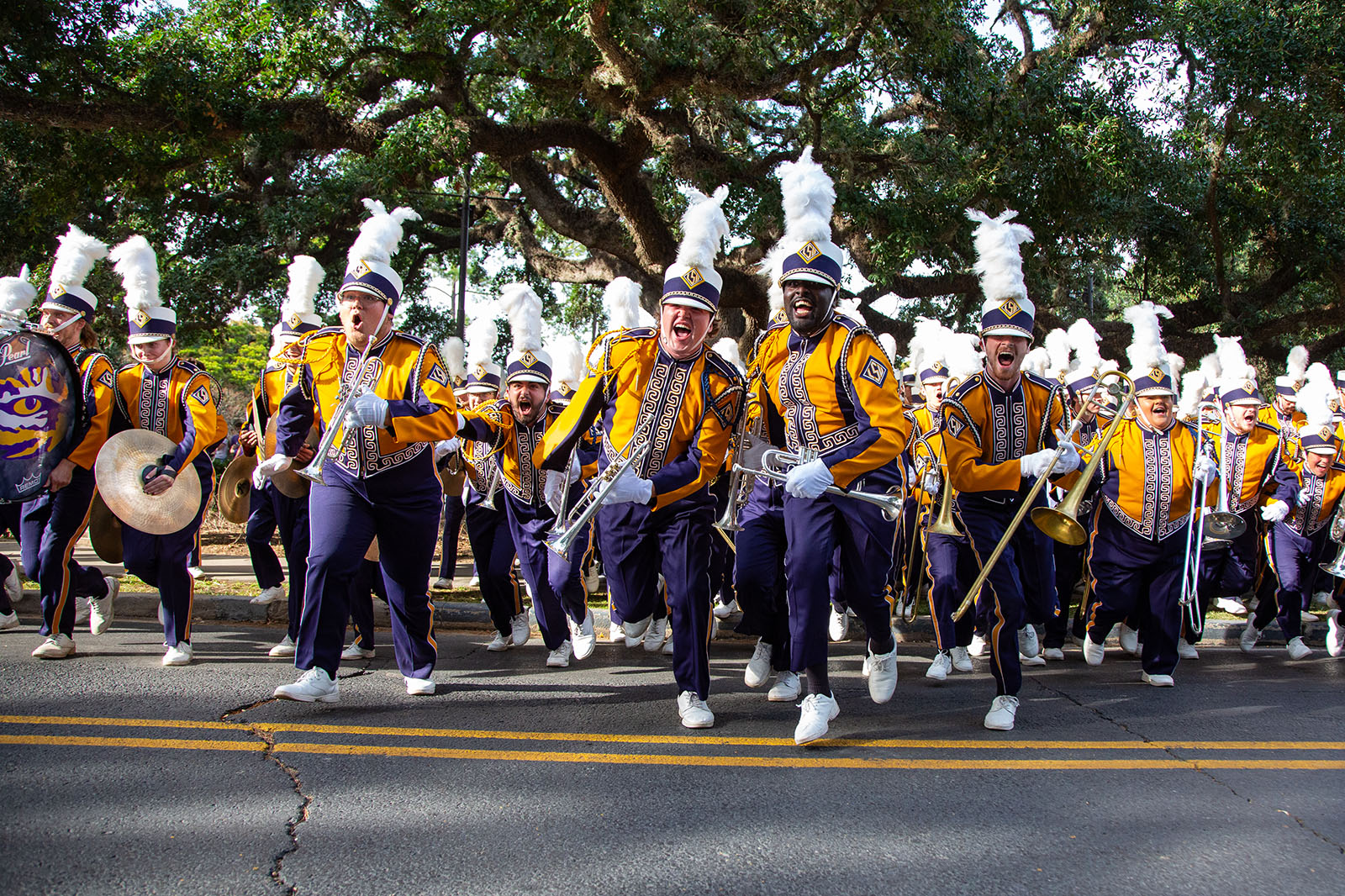 tiger band members running into the street at a home football game