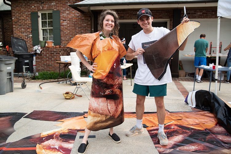 Meagan and Max pose with PPE