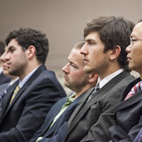 Students listen at financial seminar.